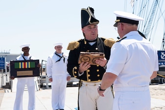BOSTON (June 30, 2021) - Chief of Naval Operations (CNO) Adm. Mike Gilday presents the Meritorious Unit Commendation to the crew of USS Constitution. The crew earned the award for their success in adapting to virtual tours after the pandemic began in 2020. Constitution Sailors conducted tours for more than 4.5 million people and brought the Navy’s history to quarantined Americans in all 50 states and 24 other countries. (U.S. Navy Photo by Mass Communication Specialist 1st Class Raymond D. Diaz III/Released)