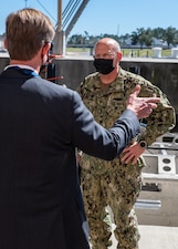 PANAMA CITY, Fla. (Mar. 4, 2021) –  Dr. Peter Adair (left), technical director at Naval Surface Warfare Center Panama City Division (NSWC PCD) speaks with Adm. Mike Gilday, Chief of Naval Operations (right) about the future of unmanned systems during his visit at NSWC PCD March 4. (U.S. Navy Photo by Anthony Powers)