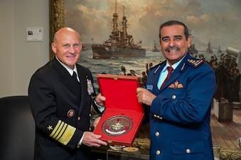 WASHINGTON (Nov. 15, 2021) Chief of Naval Operations (CNO) Adm. Mike Gilday, left, is presented a gift by Chief of Staff of the Qatari Armed Forces, Lt. Gen. Salem Hamad al-Nabet, during a meeting in the Pentagon. (U.S. Navy photo by Mass Communication Specialist 1st Class Sean Castellano/Released)
