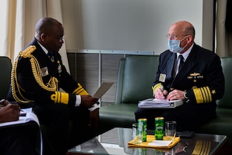 Chief of Naval Operations (CNO) Adm. Mike Gilday, right, speaks with Chief of Naval Staff of the Federal Republic of Nigeria, Vice Adm. Awwal Gambo, at the 24th International Seapower Symposium (ISS).