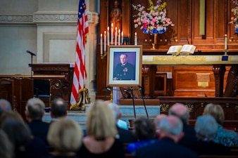 ANNAPOLIS, Md. (Sept. 20, 2021) A photo of the 23rd Chief of Naval Operations (CNO), Adm. Carlisle Trost, is displayed at a memorial service in his honor at the U.S. Naval Academy. Trost was the CNO from 1986 to 1990. (U.S. Navy photo by Mass Communication Specialist 1st Class Sean Castellano/Released)