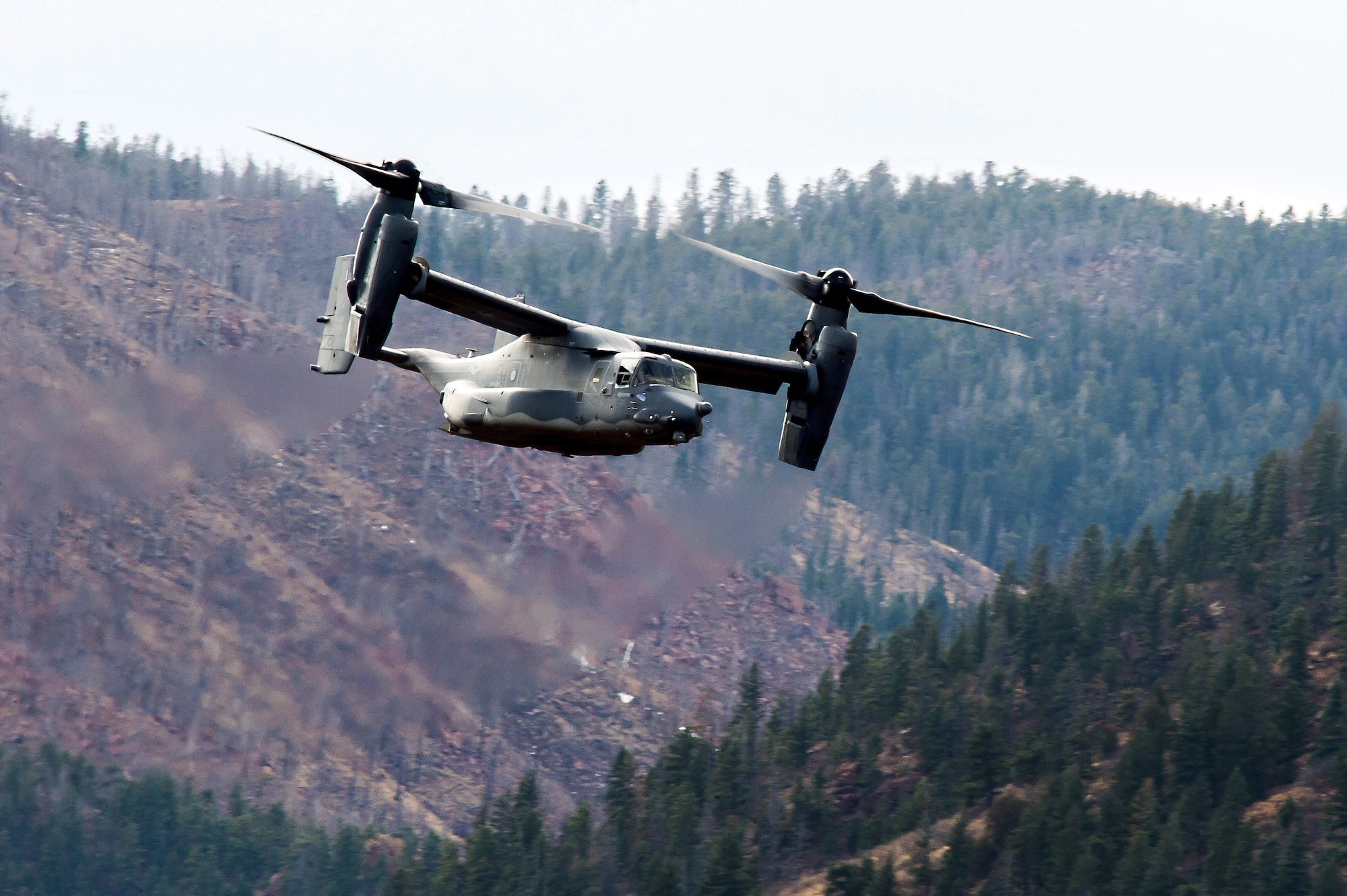 A CV-22 Osprey from Kirtland Air Force Base flies over the U.S. Air Force Academy