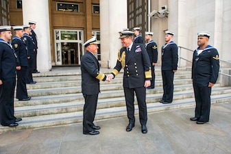 LONDON (Aug. 18, 2022) - Chief of Naval Operations Adm. Mike Gilday shakes hands with Royal Navy Adm. Sir Ben Key, First Sea Lord and Chief of the Naval Staff of the United Kingdom, outside the Ministry of Defense in London, England, Aug. 18. This visit was part of an international trip to Spain and the United Kingdom to engage with Sailors and meet with local military and government leadership to discuss regional and maritime security, as well as interoperability.  (U.S. Navy photo by Chief Mass Communication Specialist Amanda R. Gray/released)
