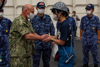 PACIFIC OCEAN (July 22, 2022) - Chief of Naval Operations Adm. Mike Gilday meets with sailors aboard the Japan Maritime Self-Defense Force helicopter carrier JS Izumo (DDH-183) during Rim of the Pacific (RIMPAC) 2022, July 22. Twenty-six nations, 38 ships, four submarines, more than 170 aircraft and 25,000 personnel are participating in RIMPAC from June 29 to Aug. 4 in and around the Hawaiian Islands and Southern California. The world's largest international maritime exercise, RIMPAC provides a unique training opportunity while fostering and sustaining cooperative relationships among participants critical to ensuring the safety of sea lanes and security on the world's oceans. RIMPAC 2022 is the 28th exercise in the series that began in 1971. (U.S. Navy photo by Chief Mass Communication Specialist Amanda R. Gray/Released)