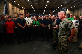PACIFIC OCEAN (July 22, 2022) Chief of Naval Operations Adm. Mike Gilday speaks to Sailors in the hangar bay aboard Nimitz-class aircraft carrier USS Abraham Lincoln (CVN 72) during Rim of the Pacific (RIMPAC) 2022. Twenty-six nations, 38 ships, three submarines, more than 170 aircraft and 25,000 personnel are participating in RIMPAC from June 29 to Aug. 4 in and around the Hawaiian Islands and Southern California. The world’s largest international maritime exercise, RIMPAC provides a unique training opportunity while fostering and sustaining cooperative relationships among participants critical to ensuring to safety of sea lanes and security on the world’s oceans. (U.S. Navy photo by Mass Communication Specialist 3rd Class Kassandra Alanis/released)
