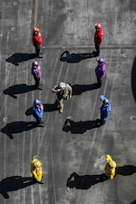 PACIFIC OCEAN (July 22, 2022) Chief of Naval Operations Adm. Mike Gilday salutes the side boys as he arrives aboard Nimitz-class aircraft carrier USS Abraham Lincoln (CVN 72) during Rim of the Pacific (RIMPAC) 2022. Twenty-six nations, 38 ships, four submarines, more than 170 aircraft and 25,000 personnel are participating in RIMPAC from June 29 to Aug. 4 in and around the Hawaiian Islands and Southern California. The world’s largest international maritime exercise, RIMPAC provides a unique training opportunity while fostering and sustaining cooperative relationships among participants critical to ensuring to safety of sea lanes and security on the world’s oceans. (U.S. Navy photo by Mass Communication Specialist 3rd Class Javier Reyes)