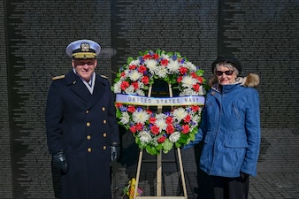WASHINGTON (Mar. 29, 2022) Chief of Naval Operations Adm. Mike Gilday, left, poses for a picture with Mrs. Ann Smith during a wreath laying at the Vietnam Veterans Memorial on National Vietnam War Veterans Day. Anne Smith is the widow of Lt. Cmdr. James A. Smith, who was killed in action aboard the USS Oriskany during the Vietnam War. (U.S. Navy photo by Mass Communication Specialist 1st Class Sean Castellano/Released)