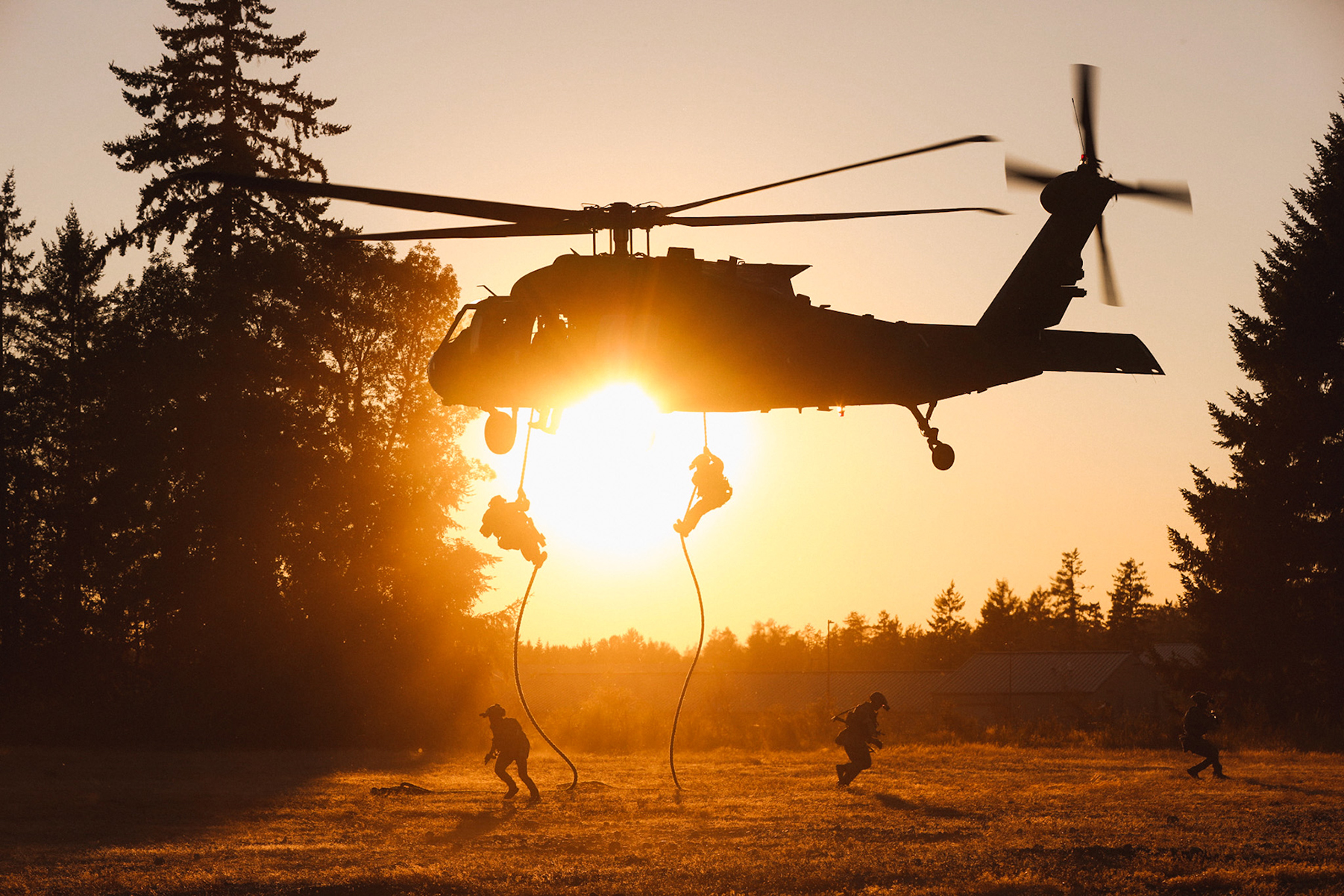 Soldiers are conducting a fast rope insertion.