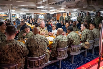 YOKOSUKA, Japan (Nov. 23, 2023) – Master Chief Petty Officer of the Navy James Honea has Thanksgiving dinner with Sailors aboard the U.S. Navy's only forward-deployed aircraft carrier USS Ronald Reagan (CVN 76), Nov. 23. Chief of Naval Operations Adm. Lisa Franchetti and Honea visited Reagan and other 7th Fleet commands to engage with Sailors and Navy leadership to highlight Franchetti's priority of strengthening the Navy team. (U.S. Navy photo by Chief Mass Communication Specialist Amanda R. Gray)