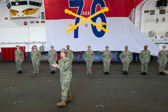 YOKOSUKA, Japan (Nov. 23, 2023) – Chief of Naval Operations Adm. Lisa Franchetti delivers remarks before reenlisting Sailors aboard the U.S. Navy's only forward-deployed aircraft carrier USS Ronald Reagan (CVN 76), Nov. 23. CNO and Master Chief Petty Officer of the Navy James Honea served Thanksgiving dinner to Sailors and their families aboard the ship during their visit. (U.S. Navy photo by Chief Mass Communication Specialist Amanda R. Gray)