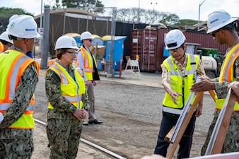 PEARL HARBOR, Hawaii - Chief of Naval Operations Adm. Lisa Franchetti meets with command leadership during a tour of Dry Dock 5 at the Pearl Harbor Naval Shipyard and Intermediate Maintenance Facility in Pearl Harbor, Hawaii, April 3. Franchetti was able to interact with Navy leadership and civilians working on the Navy’s largest maritime infrastructure construction project since World War II. (U.S. Navy photo by Chief Mass Communication Specialist Amanda Gray)