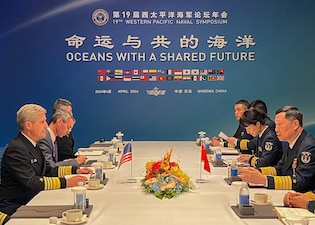 Adm. Stephen Koehler meets with Adm. Hu Zhongming, commander of the People’s Liberation Army Navy at the Western Pacific Naval Symposium in Qingdao, China.