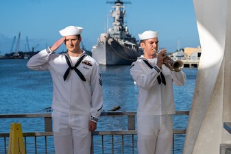 Sailors play "Taps" at the USS Arizona Memorial during a memorial service for retired Lt. Cmdr. Louis “Lou” Conter, the last survivor of the Dec. 7, 1941 Japanese attack on the USS Arizona (BB 39).