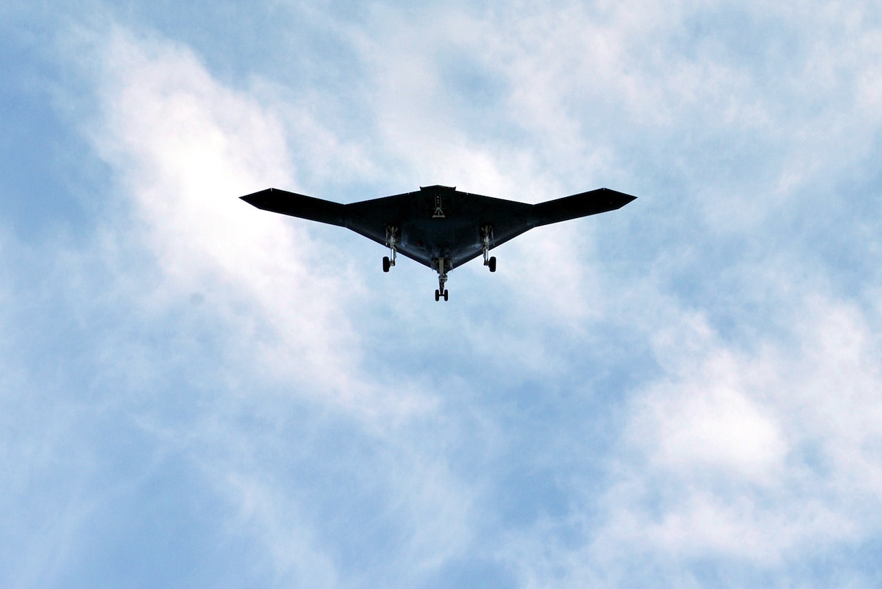 An unmanned military aircraft is photographed flying overhead.