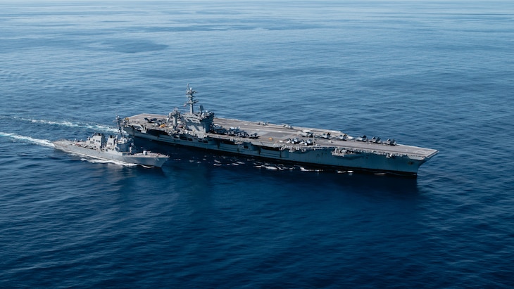 USS George Washington (CVN 73) and USS Porter (DDG 78) underway in the Atlantic Ocean.