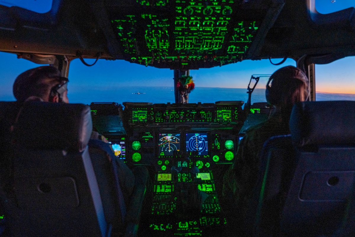 U.S. Air Force Lt. Col. Ollney Hoopai III, 204th Airlift Squadron pilot and 1st Lt. Cassidy Mullen, 535th Airlift Squadron pilot, conducts a C-17 Globemaster III airdrop mission during the Joint Pacific Multinational Readiness Center 24-1 over Malemute Drop Zone, Alaska, Nov. 2, 2023. The Joint Pacific Multinational Readiness Center (JPMRC) is the Army's newest Combat Training Center (CTC and generates readiness in the environments and conditions where our forces are most likely to operate in. JPMRC 24-1 includes over 5,300 training participants from across the U.S. Joint Force, New Zealand, the United Kingdom, Indonesia, and Thailand. (U.S. Air National Guard photo by Mysti Bicoy)