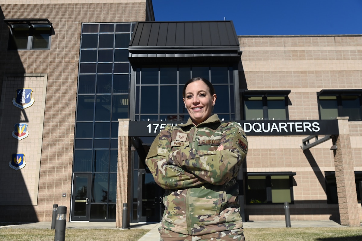 U.S. Air National Guard Staff Sgt. Brooke Parks, 175th Force Support Squadron recruiter, poses for a photo in front of the 175th Wing Headquarters building at Warfield Air National Guard Base, MD (U.S. Air National Guard photo by Staff Sgt. Julian W. Kemper)