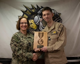240316-N-EI510-2191 BEAUFORT SEA, Arctic Circle (March 16, 2024) – Chief of Naval Operations Adm. Lisa Franchetti poses for a photo with Kyle McVay, commanding officer of the Virginia-class fast-attack submarine USS Indiana (SSN 789), after announcing the new Arctic Service Medal aboard the Indiana during Operation Ice Camp (ICE CAMP) 2024. ICE CAMP is a three-week operation that allows the Navy to assess its operational readiness in the Arctic, increase experience in the region, advance understanding of the Arctic environment, and continue to develop relationships with other services, allies, and partner organizations. (U.S. Navy photo by Mass Communication Specialist 1st class Scott Barnes)