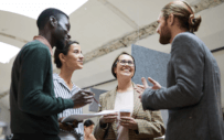 Four people in conversation