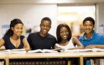 Four students smiling