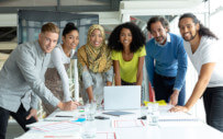 people standing around a table