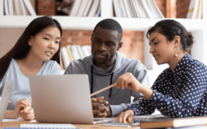 three people looking at a laptop screen