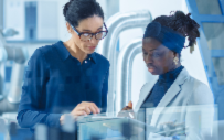 An employee at IBM works with an intern.