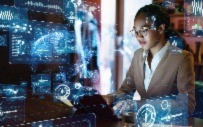 A computer science student works on her computer.