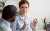 An employer discusses career readiness with an intern.