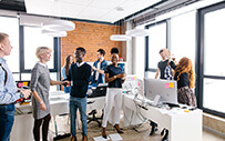 A group of students market themselves at a reverse career fair