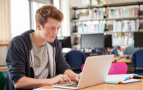 A student takes part in a virtual escape room with his university's career services department.