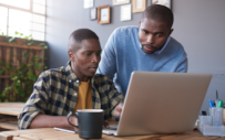 A career services professional works with a student and Tougaloo.