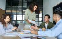 A group of interns works together on a project.