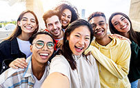 A group of college students smile.