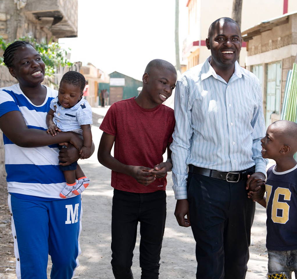 Family of five walking down street