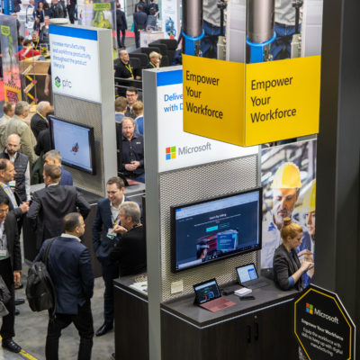 Attendees check out customer solutions in the Microsoft booth at Hannover Messe 2019