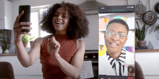 Two women talking over Microsoft Teams, one of them on a phone and the other from a desktop