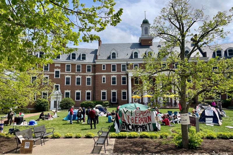 Photo of gathering of people on the lawn of the Graduate Life Center