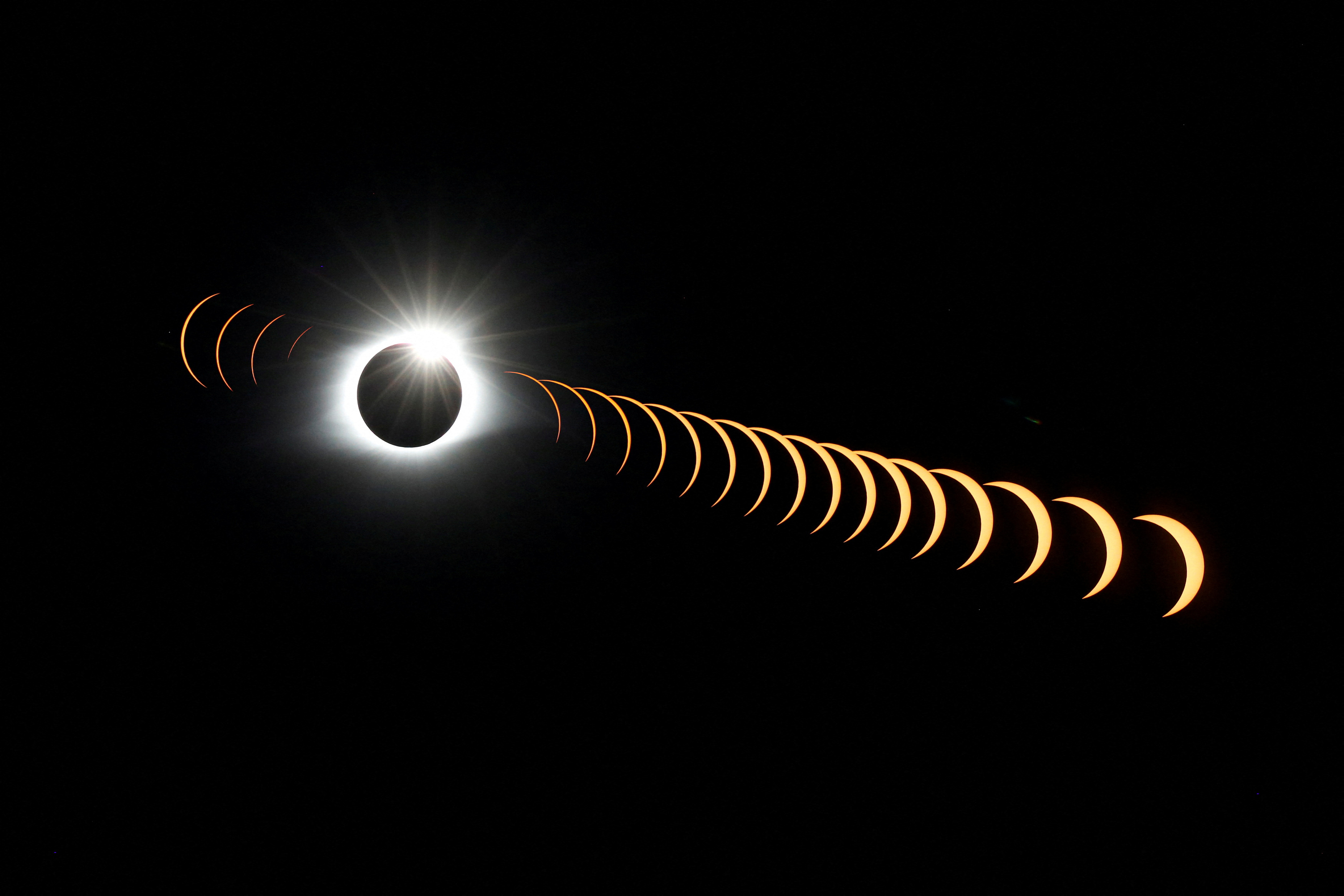 FILE PHOTO: A composite image of 21 separate photographs taken with a single fixed camera shows the solar eclipse as it creates the effect of a diamond ring at totality as seen from Clingmans Dome, which at 6,643 feet (2,025m) is the highest point in the Great Smoky Mountains National Park, Tennessee, U.S. August 21, 2017. REUTERS/Jonathan Ernst/File Photo FILE PHOTO: A composite image of 21 separate photographs taken with a single fixed camera shows the solar eclipse as it creates the effect of a diamond ring at totality as seen from Clingmans Dome