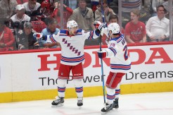 New York Rangers left wing Artemi Panarin celebrates with left wing Chris Kreider after scoring a goal during the third period on Sunday.