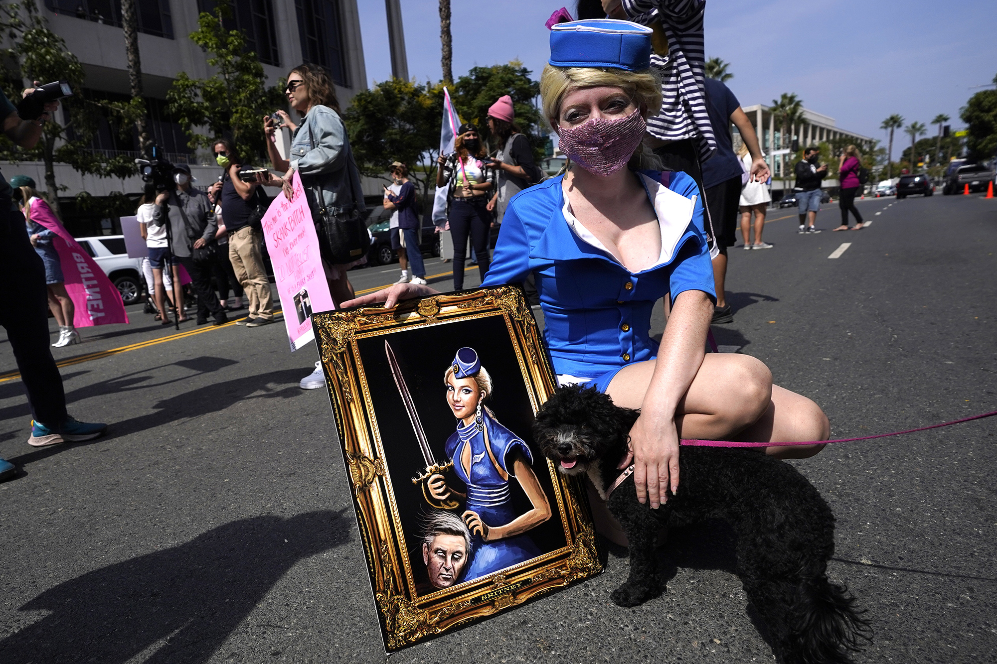 Britney Spears supporter and artist Never Tara of Los Angeles displays her painting outside the Stanley Mosk Courthouse, Wednesday, Sept. 29, 2021