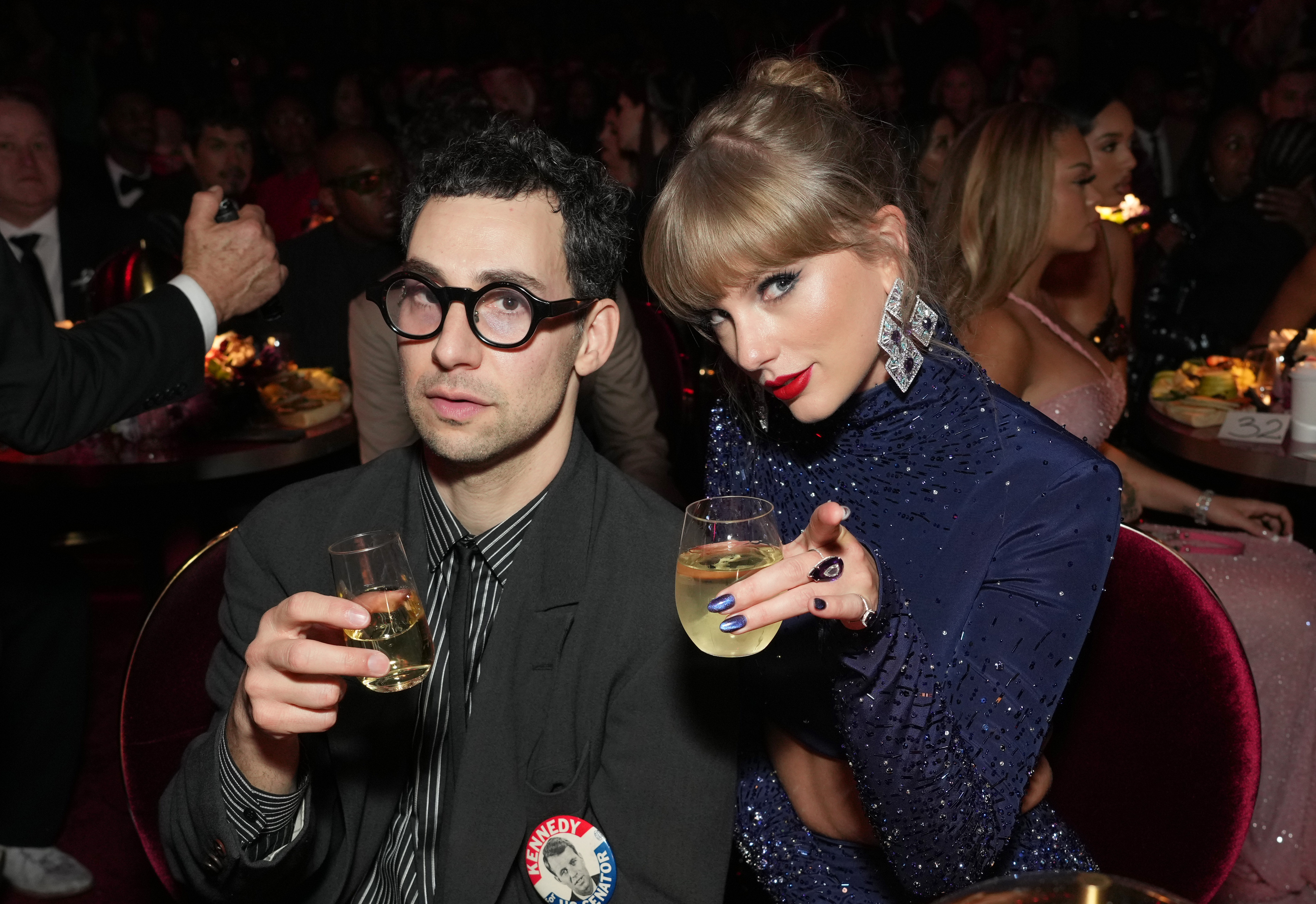 taylor swift and jack antonoff holding glasses of wine
