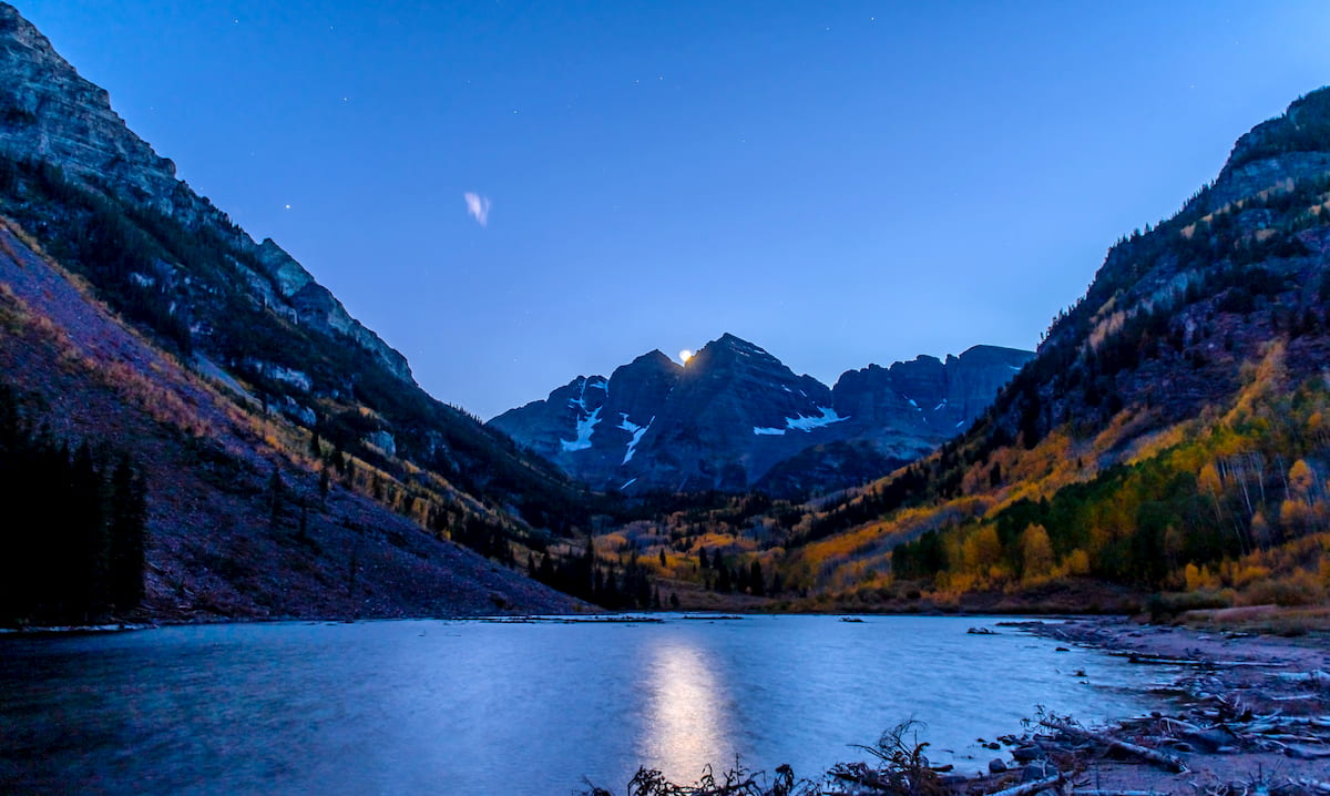 The Moon between Maroon Bells