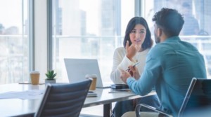 Business woman and man meeting and talking