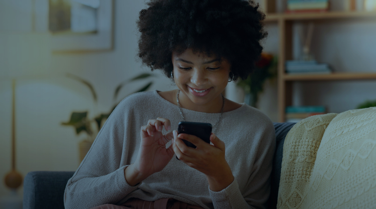 Woman at home scrolling through phone