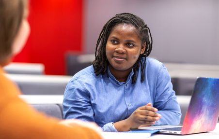 Imperial Business School Dean's Fund recipient Anita Asiedu works on a laptop