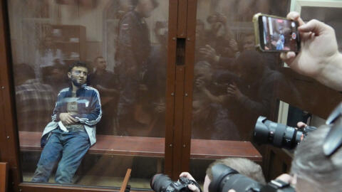 Dalerdzhon Mirzoyev, a suspect in the Crocus City Hall shooting on Friday, sits in a glass cage in the Basmanny District Court in Moscow, Russia on March 24, 2024.