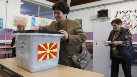 A woman casts her ballot for the presidential elections at a polling station in Skopje, North Macedonia, on Wednesday, April 24, 2024.