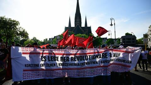 Participants gather with banners and flags for the "Revolutionary" May Day demonstration in Berlin on Labour Day, May 1, 2024.