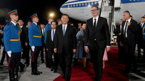 Serbian President Aleksandar Vucic (Centre R) and Chinese President Xi Jinping (Centre R) walk side by side during a welcoming ceremony on May 7, 2024 at Belgrade Airport, Serbia.